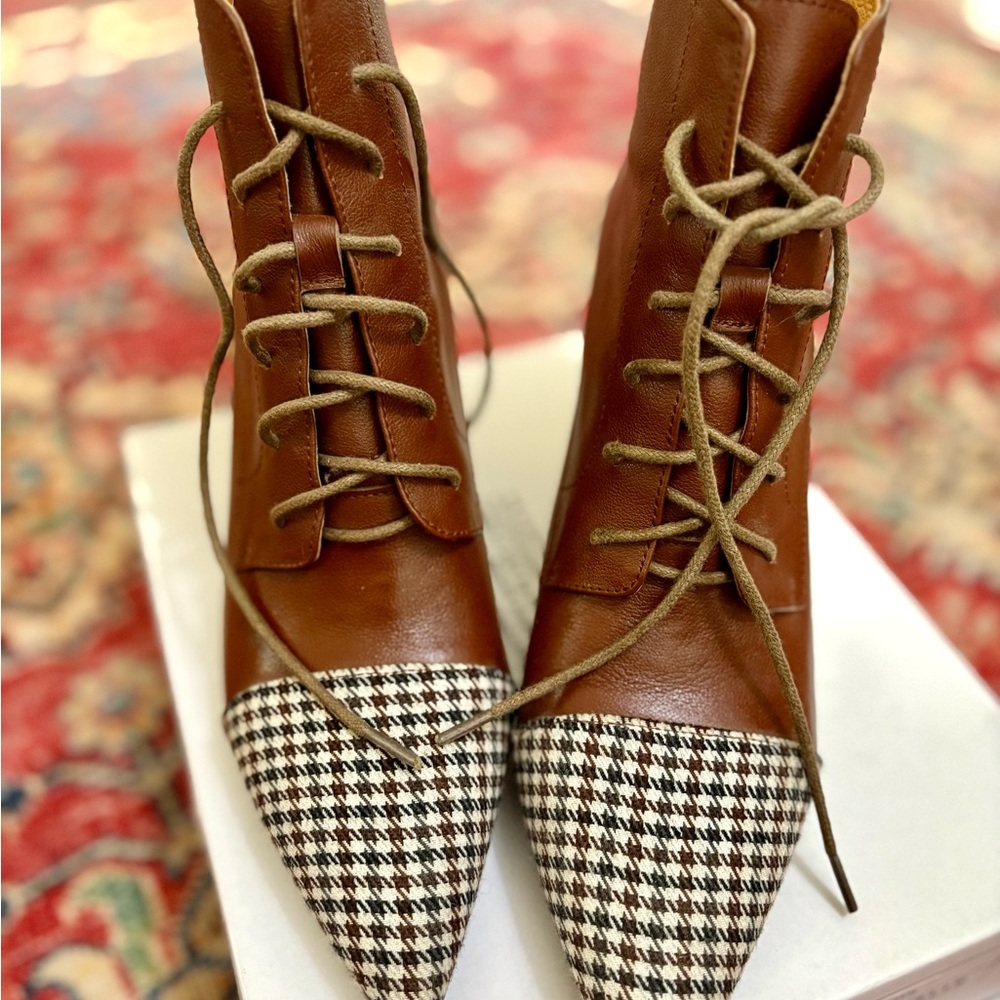 Brown and Black Lace Up Boots with Vintage Charm.